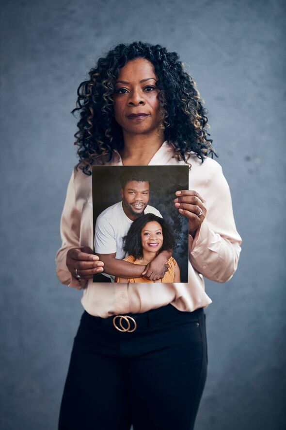 Julie Davis holds a picture of her son Levi