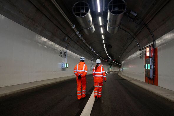 Construction workers in the new Silvertown Tunnel in east London