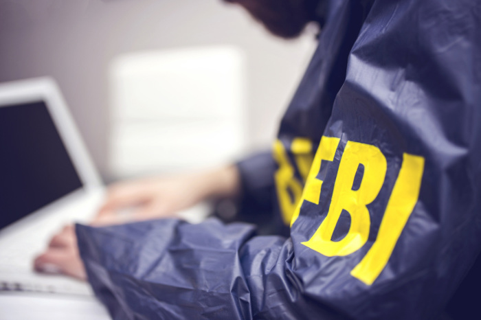 An FBI agent at a computer.