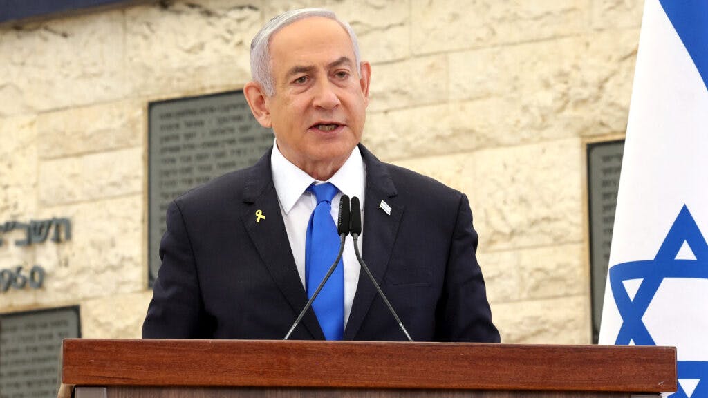 Israeli Prime Minister Benjamin Netanyahu speaks during a memorial ceremony for Israelis killed on the Hebrew calendar anniversary of the Hamas attack on October 7 last year that sparked the ongoing war in Gaza, at the Mount Herzl military cemetery in Jerusalem on October 27, 2024.