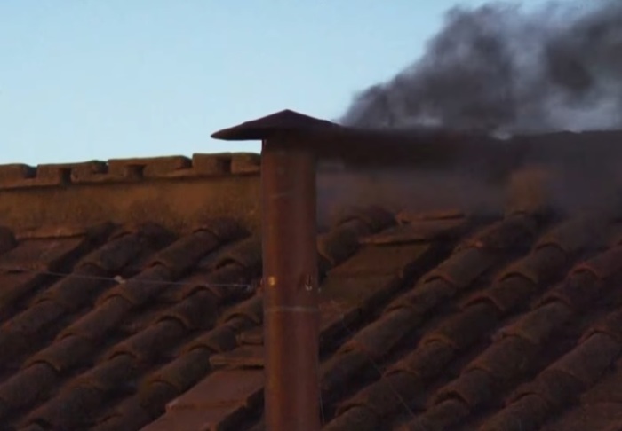 Black smoke eminates from the Sistine Chapel in the Vatican on May 7, 2025, as the papal conclave's first ballot failed to produce a new pope following the death of Pope Francis last month.
