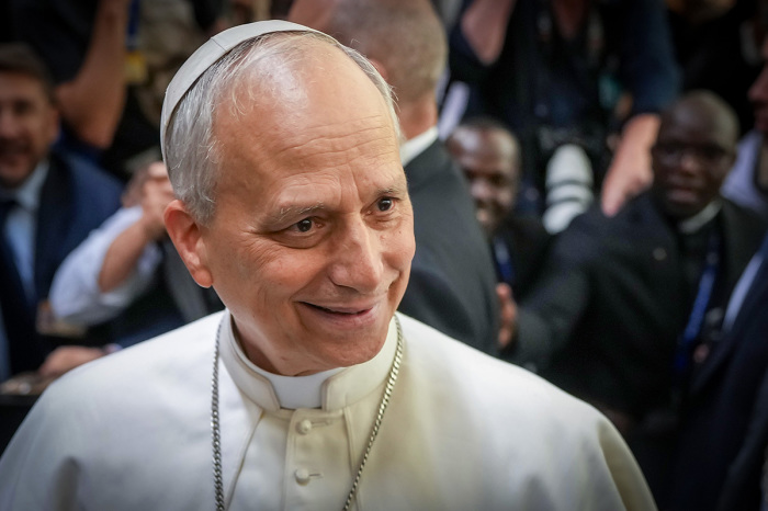 Pope Leo XIV shakes the hands and greets people of the press after an audience with thousands of journalists and media workers on May 12, 2025, at Paul VI Hall in Vatican City, Vatican. The audience with journalists has become a tradition among newly elected popes.
