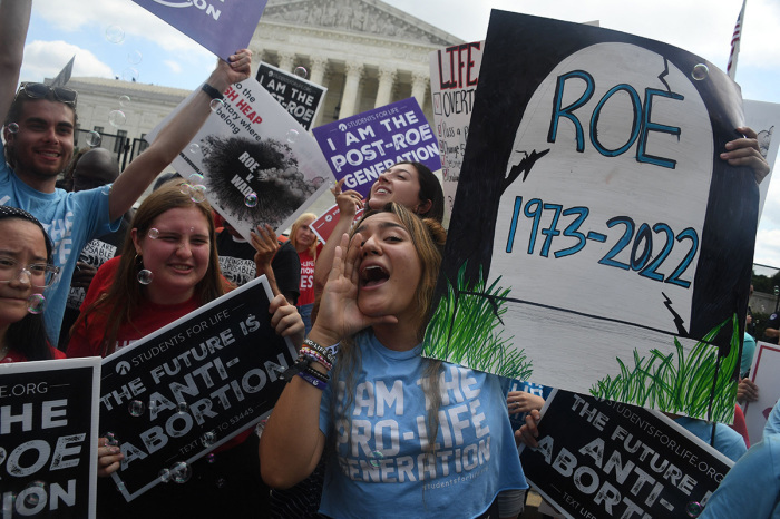Anti-abortion campaigners celebrate outside the U.S. Supreme Court in Washington, D.C., on June 24, 2022.