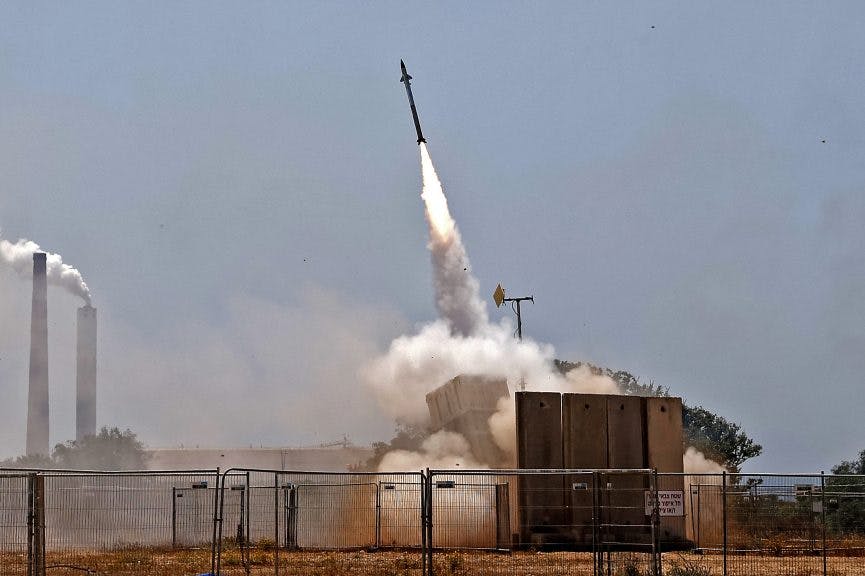 Israel's Iron Dome aerial defence system intercepts rockets launched from the Gaza Strip, controlled by the Palestinian Hamas movement, above the southern Israeli city of Ashkelon, on May 11, 2021. - Israel and Hamas exchanged heavy fire, in a dramatic escalation between the bitter foes sparked by unrest at Jerusalem's flashpoint Al-Aqsa Mosque compound.