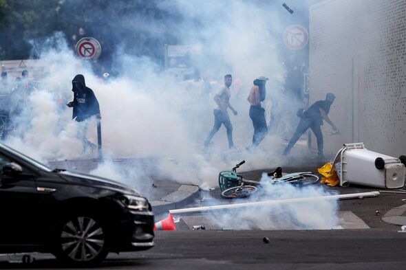Individuals clash with police officers 