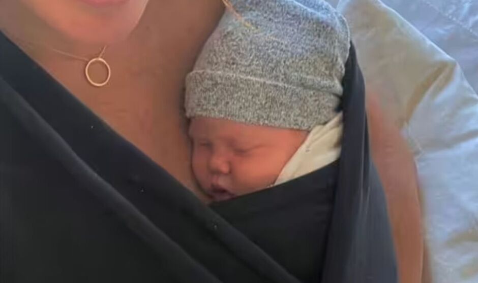 Princess Lilibet in a sling