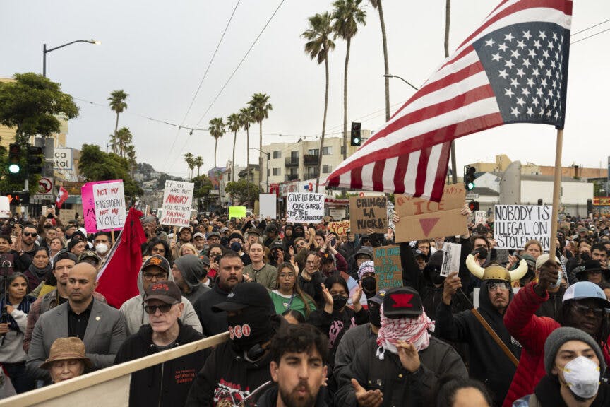 Protesters hold signs as they march in response to federal immigration operations in the Mission District of San Francisco, California on June 9, 2025. President Donald Trump's administration said on June 9 that it was sending 700 US Marines and thousands more National Guard troops to Los Angeles, sparking a furious response from California's governor over the "deranged" deployment. Protests in Los Angeles, home to a large Latino population, broke out on June 6, triggered by immigration raids that resulted in dozens of arrests of what authorities say are illegal migrants and gang members.