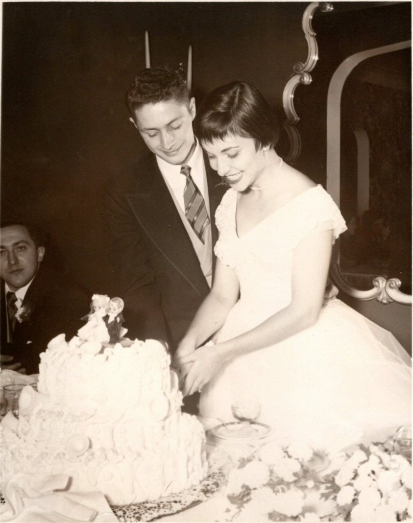 A young couple, John and Christina Habeeb cutting their wedding cake in 1954.
