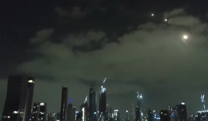 Iranian missiles fly over the skyline of Tel Aviv, Israel, on June 16, 2025.