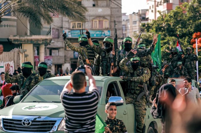 Hamas militants parade at a rally,