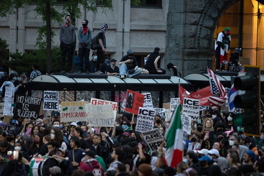 SEATTLE, WASHINGTON - JUNE 11: Protestors gather in front of the Henry M. Jackson Federal building during a protest against federal immigration arrests on June 11, 2025 in Seattle, Washington. Protests against ICE raids have spread to cities across the nation after beginning in Los Angeles last weekend. (Photo by Rio Giancarlo/Getty Images)