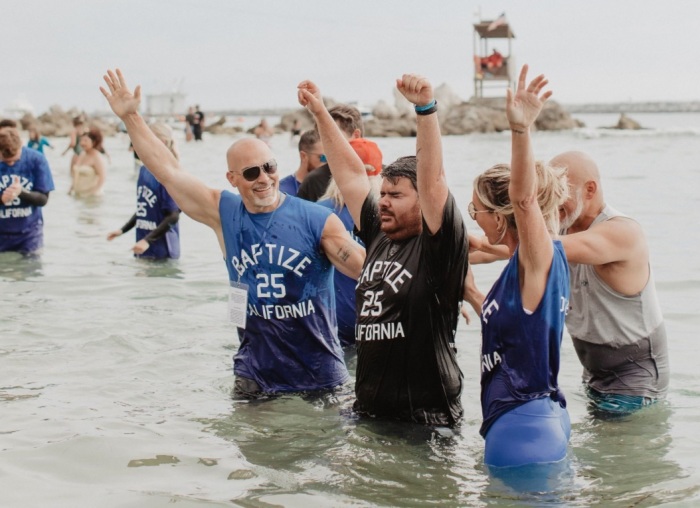 An individual is baptized at Pirate's Cove, California as part of the nationwide Baptize America revival event on Sunday, June 8, 2025.