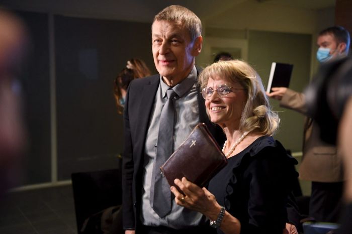 Päivi Räsänen holds a Bible as she arrives with her husband, Niilo Rasanen, to attend a court session at the Helsinki District Court in Helsinki, Finland on Jan. 24, 2022.