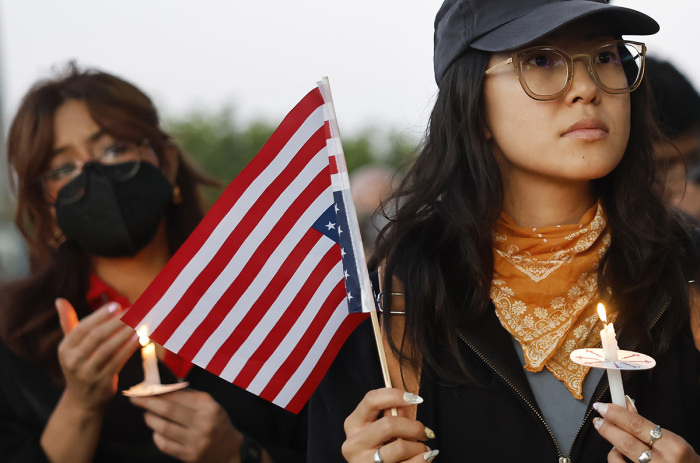 People attend a candlelight honoring Narciso Barranco and other impacted community members who have been targeted by ICE on June 27, 2025, in Santa Ana, California. Narciso Barranco is an undocumented gardener and father of three U.S. Marines who was arrested during a workplace raid by federal immigration agents on June 21st. U.S. Marine veteran Alejando Barranco, whose two younger brothers are active-duty U.S. Marines, has stated that his father has been living in the U.S. since the 1990’s and had no criminal record.