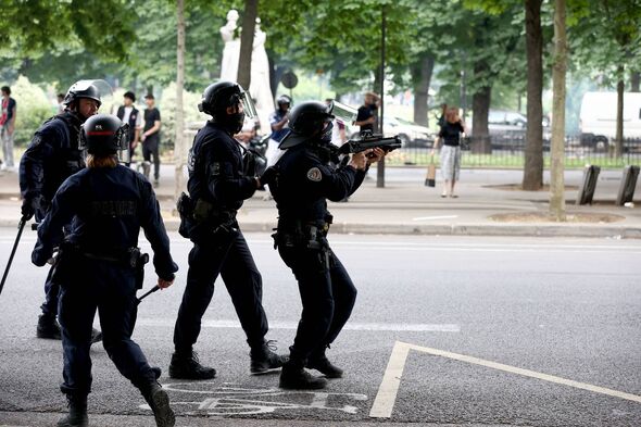 Police officers clash with crowd