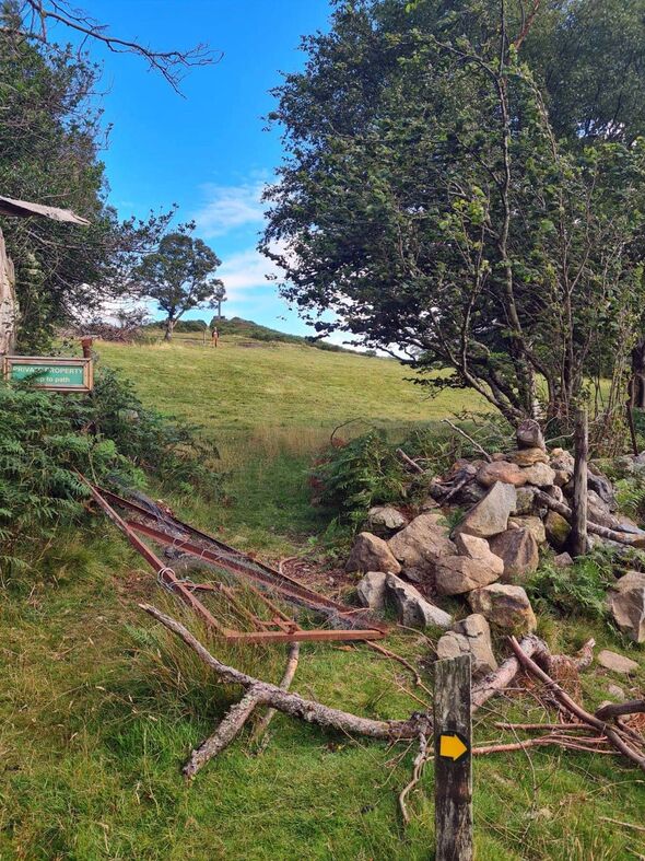 A field gate and a stone boundary wall next to another Private Property sign was 'forcibly torn down'
