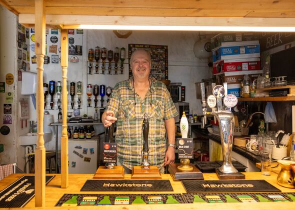 Publican Andy Le Grange behind the bar