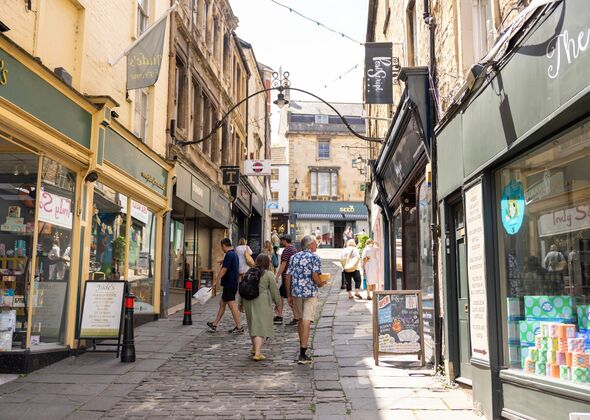 View of shops and visitors Stone Street in Frome