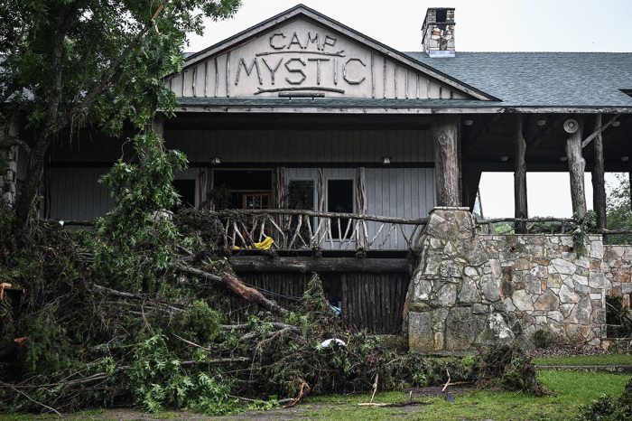 A view of Camp Mystic, the site of where initially over 20 girls went missing after flash flooding in Hunt, Texas, on July 5, 2025. That number went down to 10 by late afternoon Sunday. Rescuers continue searching for the girls missing from a riverside summer camp in Texas, after torrential rains caused devastating flooding that killed at least 82 people -- with more rain on the way. 'So far, we've evacuated over 850 uninjured people,' said Kerr Country Sheriff Larry Leitha on July 5.