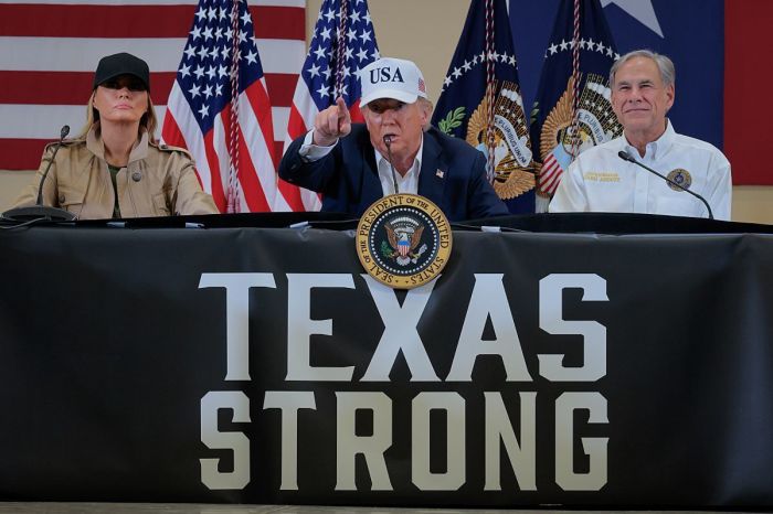 President Donald Trump, first lady Melania Trump and Texas Gov. Greg Abbott participate in a round table event at the Hill Country Youth Event Center to discuss last week's flash flooding on July 11, 2025 in Kerrville, Texas.