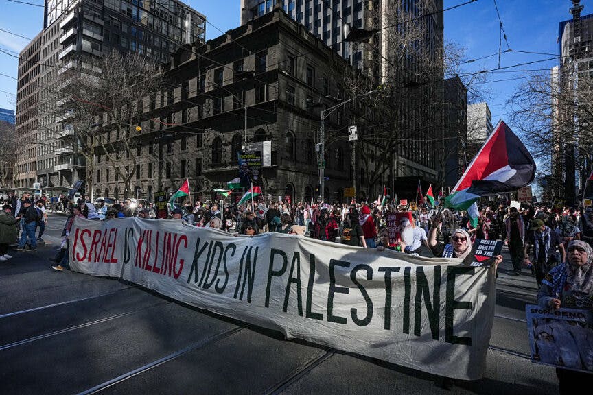 MELBOURNE, AUSTRALIA - AUGUST 03: People march during a pro-Palestinian rally on August 03, 2025 in Melbourne, Australia. Protesters in Sydney and Melbourne joined marches and actions globally, as pressure mounts on the Israeli government over a devastating humanitarian crisis unfolding as its war against Hamas continues. (Photo by Asanka Ratnayake/Getty Images)