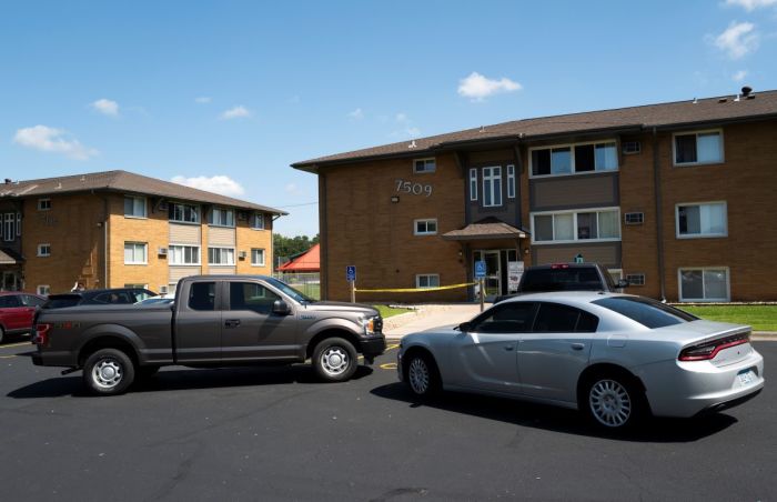 Law enforcement vehicles sit parked outside a reported residence of a suspect following a mass shooting at Annunciation Catholic School on August 27, 2025 in Richfield, Minnesota. According to Minneapolis Police, a gunman fired through the windows of the Annunciation Church at worshippers sitting in pews during a Catholic school Mass, killing two children and injuring at least 17 others. The gunman reportedly died at the scene from a self-inflicted gunshot wound.