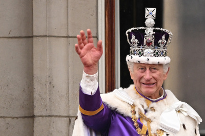 Britain's King Charles III wearing the Imperial state Crown, waves from the Buckingham Palace balcony after viewing the Royal Air Force fly-past in central London on May 6, 2023, after his coronation. The set-piece coronation is the first in Britain in 70 years, and only the second in history to be televised. Charles will be the 40th reigning monarch to be crowned at the central London church since King William I in 1066.