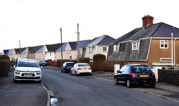 Row of houses and cars on street