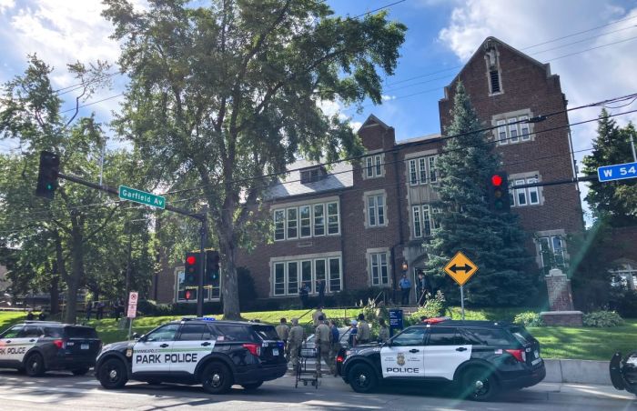 Police and first responders work at the scene of a shooting near Annunciation Church and Catholic School in Minneapolis, Minneosta, on August 27, 2025. US police responded Wednesday morning to a shooting at a Catholic school in Minneapolis, with officials saying that the shooter had been