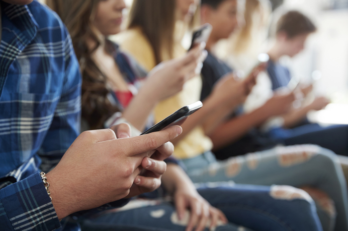 Students on their phones.