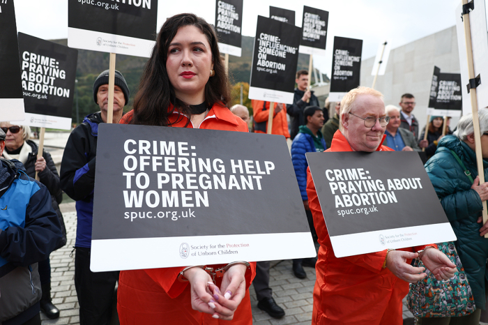 Demonstrators hold an 'abortion clinic buffer zone' protest outside the Scottish parliament on Sept. 24, 2024, in Edinburgh, Scotland. A new law in Scotland bans protesters from gathering within 200 meters of clinics where abortions are carried out. The anti-abortion group Society for the Protection of Unborn Children has organized protests against the measure.
