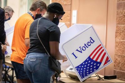 Voters cast their ballots in the voting booths at the early vote location at the Charleston Coliseum and Convention Center in North Charleston, South Carolina on October 16, 2020. Many states across the country have seen record turnout for early voting for the 2020 election. 