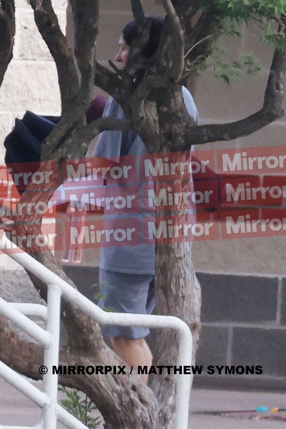 Maxwell spotted with a yoga mat and her umbrella