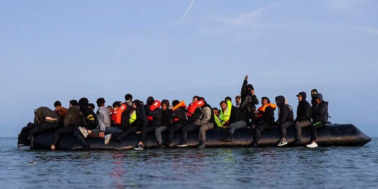 125 migrants cross Channel in 'mega dinghy' marking record number load on single boat