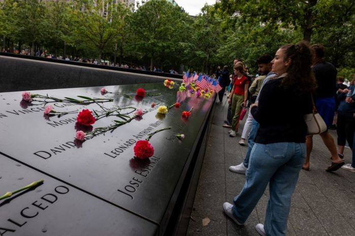 People gather at the National September 11 Memorial & Museum on September 10, 2025, in New York City. The nation will commemorate the twenty-fourth anniversary of the attacks on September 11, 2001, which killed 2,977 people at the World Trade Center, the Pentagon, and those aboard Flight 93 in Shanksville, PA.