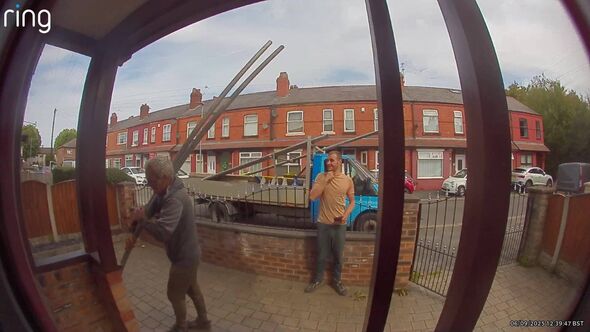 The workers, the van, and the scaffolding