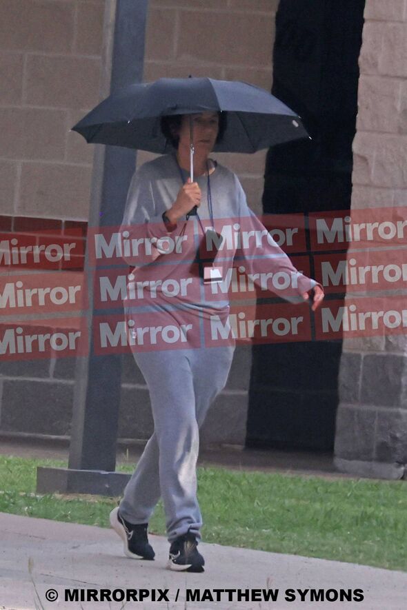 Maxwell walking in her prison clothes