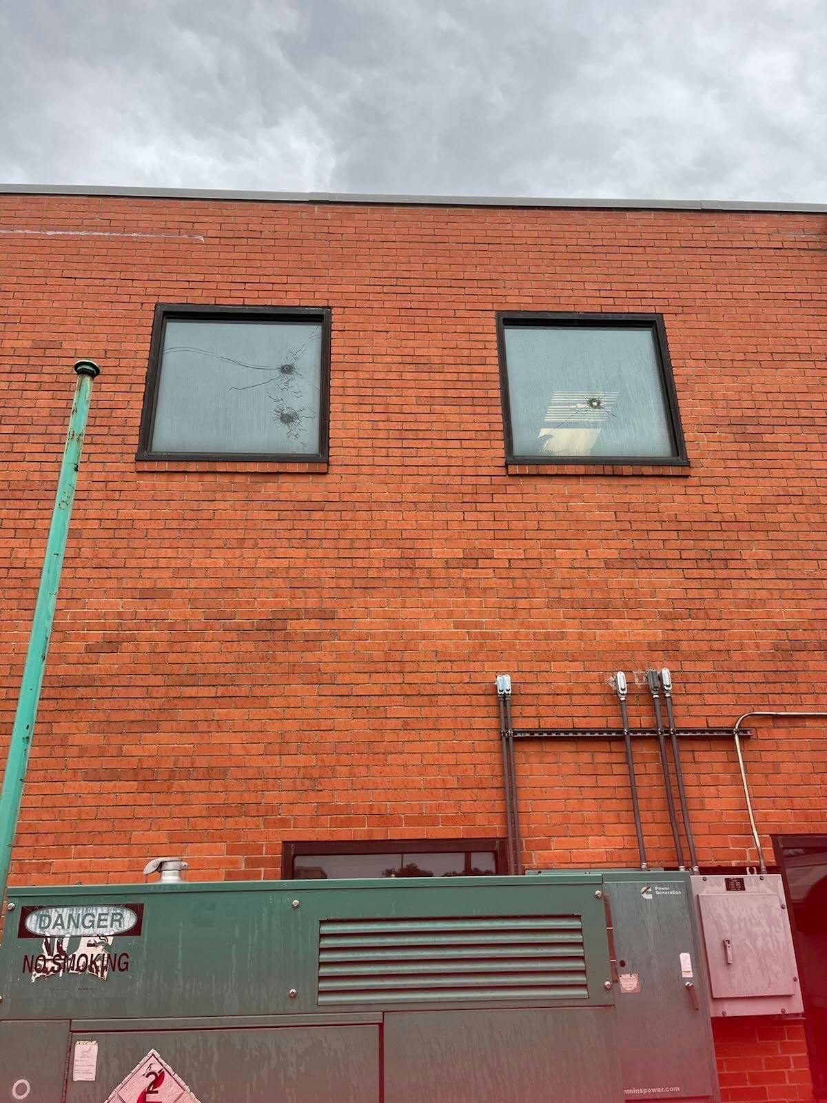 Photo obtained by The Daily Wire shows bullet holes in windows at the ICE detention center in Dallas following Wednesday's shooting.