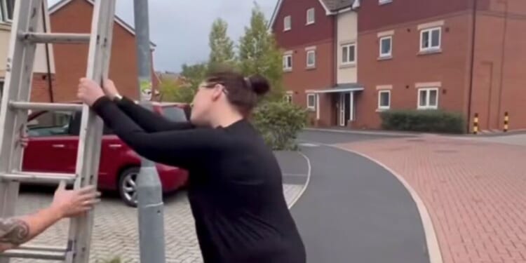 Moment furious woman calls police on men putting up Union Jack flags on her street | UK | News
