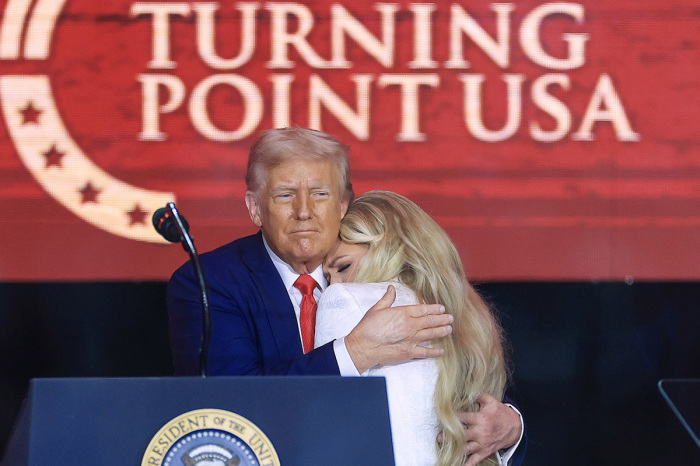 Erika Kirk joins U.S. President Donald Trump onstage during the memorial service for political activist Charlie Kirk at State Farm Stadium on Sept. 21, 2025, in Glendale, Arizona. Kirk, the CEO and co-founder of Turning Point USA, was shot and killed on Sept. 10 while speaking at an event during his 