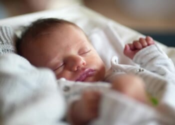 Woman charged after remains of four dead babies found in home