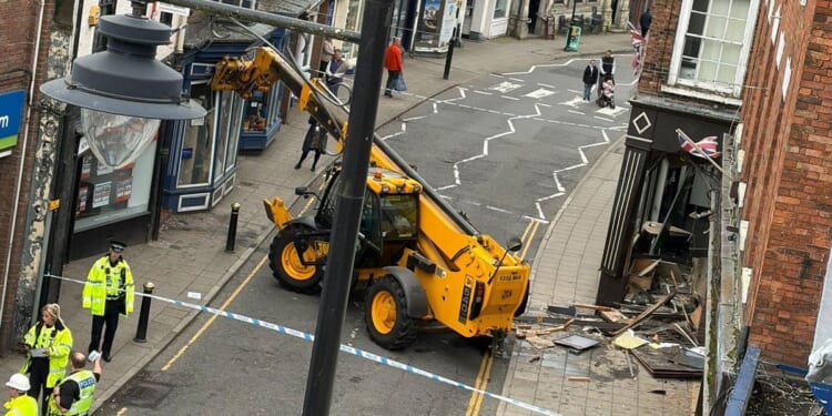 Brazen thieves rip bank's ATM from wall after ramming it with stolen JCB