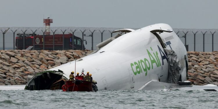One missing after aircraft slides off runway into sea