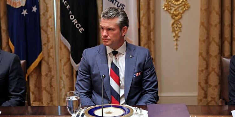 Donald Trump's Secretary of War sparks diplomatic spat after wearing 'pro-Russian tie' during Zelensky meeting