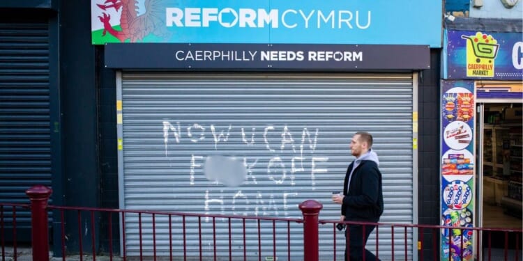 Reform UK office vandalised with 'f**k off home' message after defeat in 'dark tricks' by-election