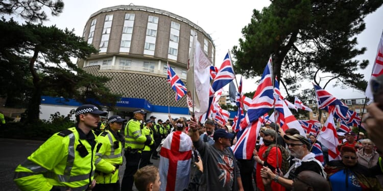 Asylum seekers who chased hotel workers with knives in dispute over food jailed