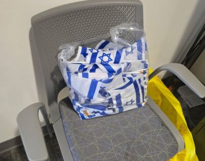 A trash bag filled with Israeli flags after Catholic University of America staff removed the Students Supporting Israel's Oct. 7 memorial display. CUA said that the display violated its university policies.