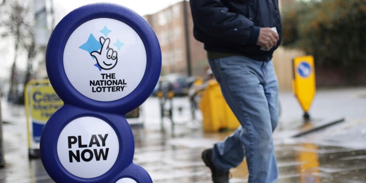 National Lottery winner was 'getting signs to play on that particular day' before scooping up mega jackpot