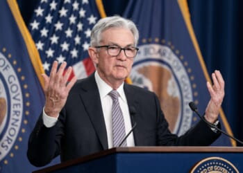 A divided Federal Reserve cuts interest rates by a quarter of a point