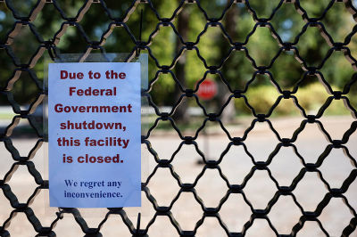 A sign on the entrance to the U.S. National Arboretum is seen as it is closed due to the federal government shut down on October 01, 2025 in Washington, DC. The government shut down early Wednesday after Congress failed to reach a funding deal.